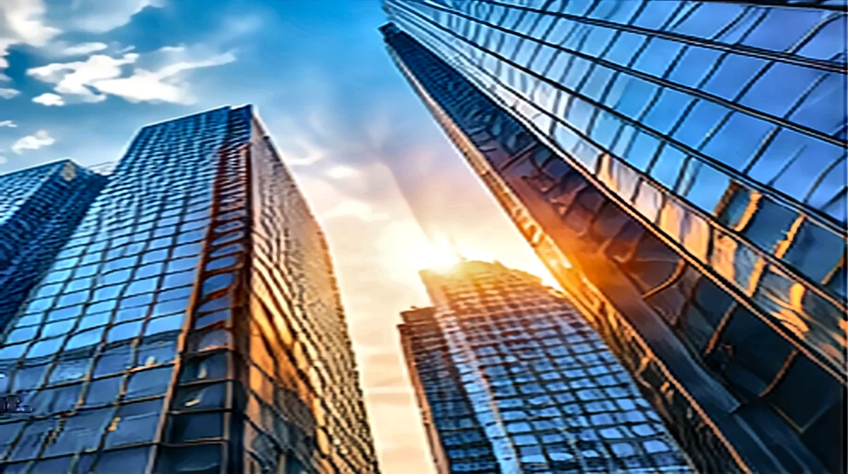 Glass office towers catching the evening sun